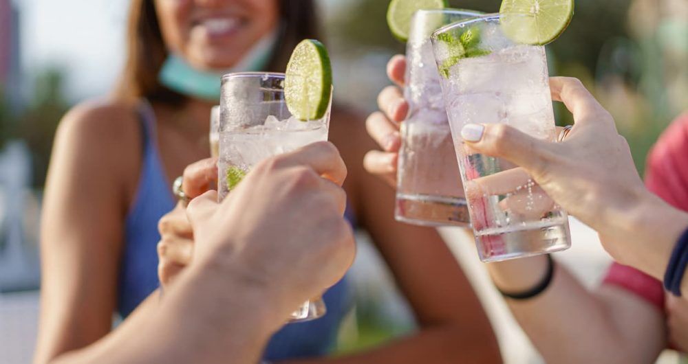Women holding up mocktails