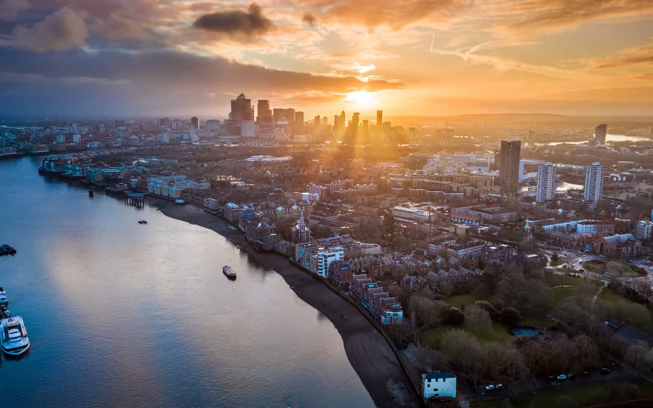 Drug and Alcohol Rehab East of England. An image of a river and a city in the distance during sunrise.